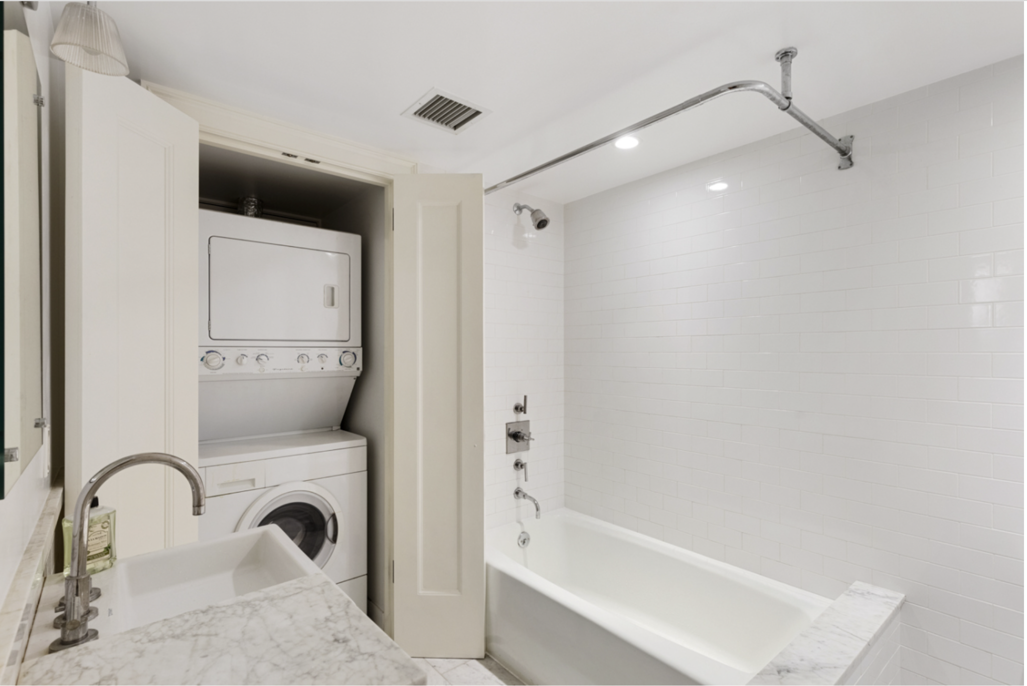 128 State Street, Unit GARDEN Brooklyn, NY 11201 - Photo 6 of 10 a bathroom with a sink and a mirror