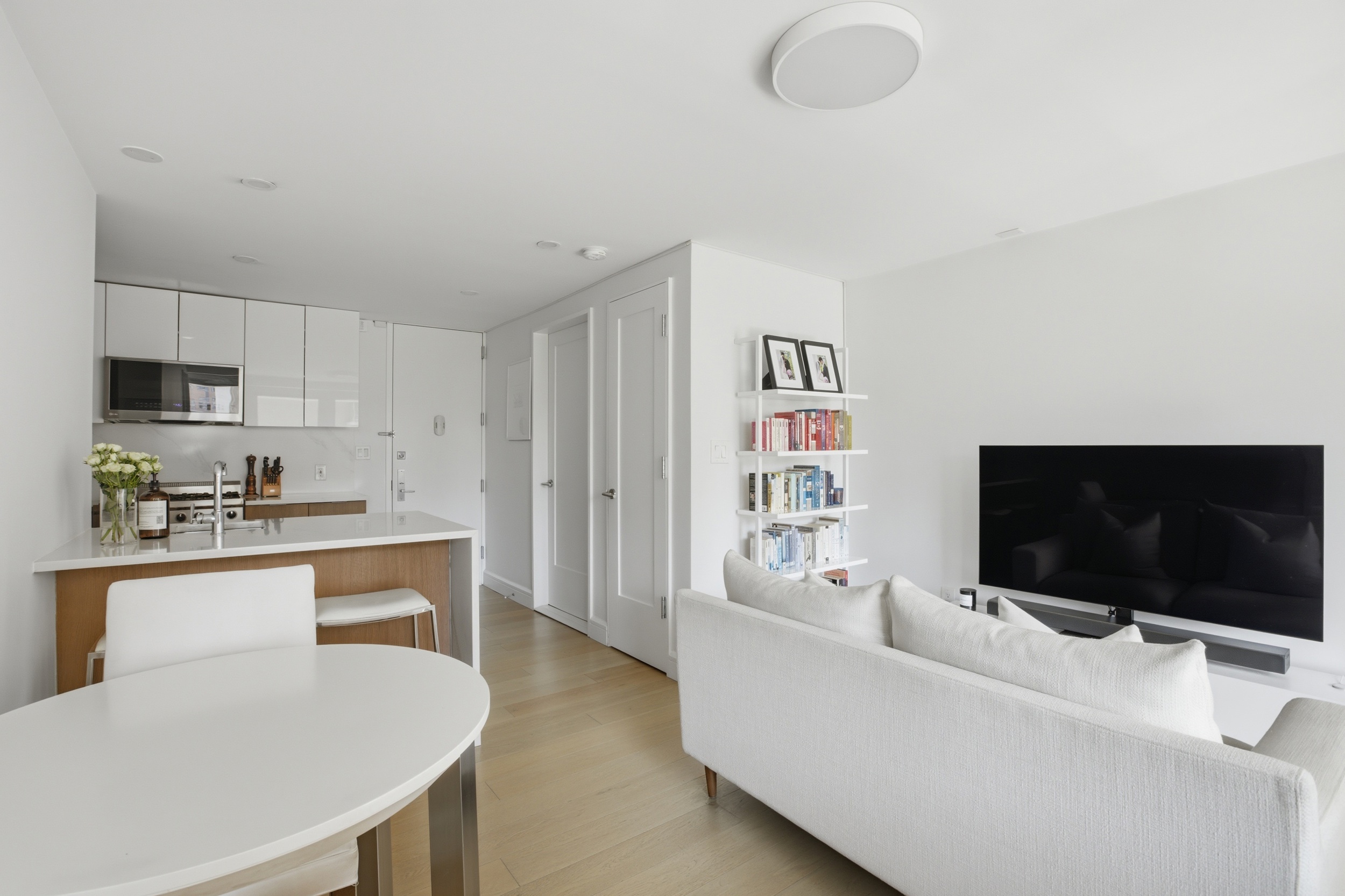 175 West 95th Street, Unit 8H Manhattan, NY 10025 - Photo 5 of 13 a living room with furniture and a flat screen tv