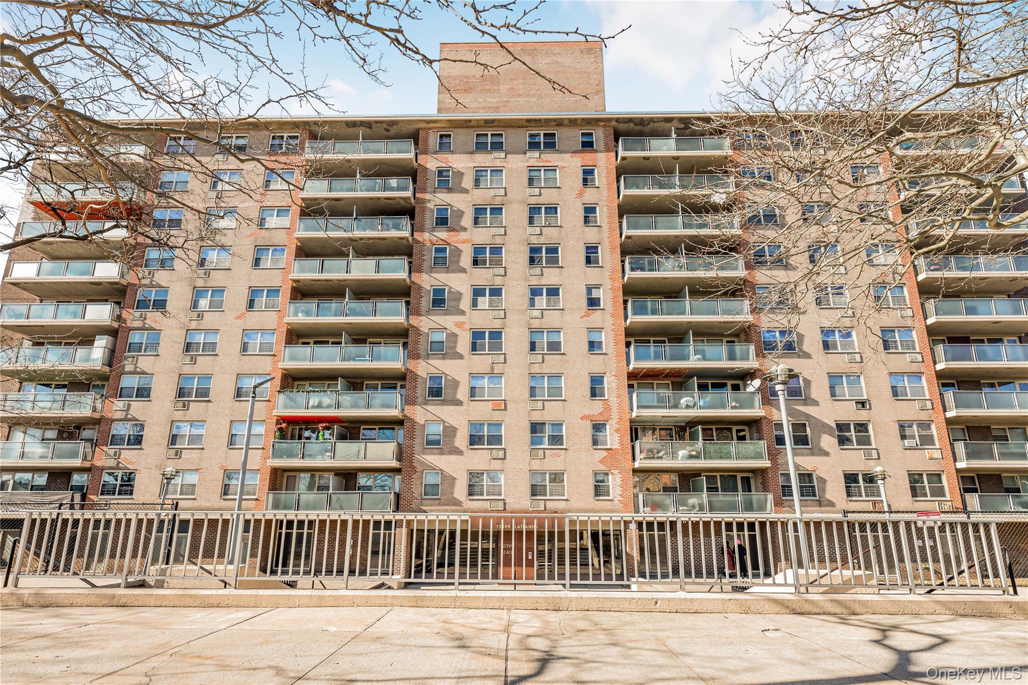 12399 Flatlands Avenue, Unit 1L Brooklyn, NY 11207 - Photo 17 of 21 a view of a building with a street