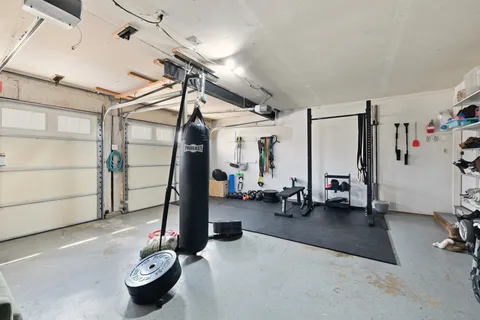 a living room with furniture ceiling fan and a rug
