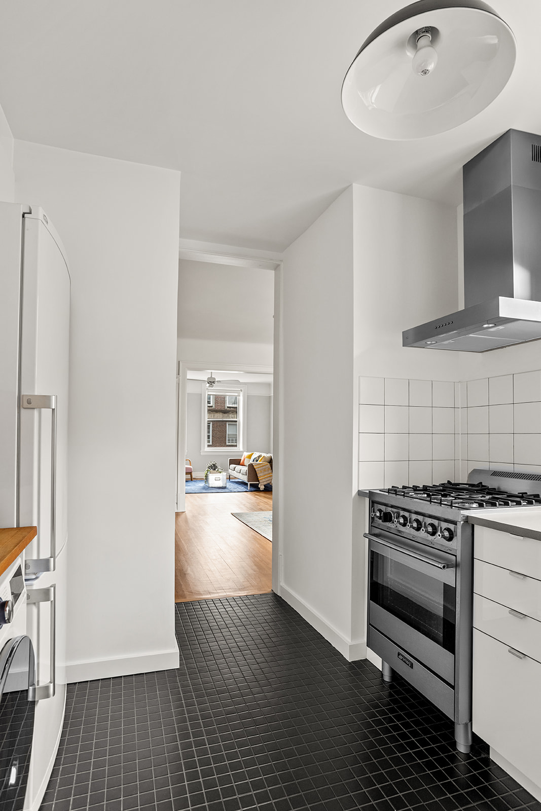 34-43 82nd Street, Unit 51 Queens, NY 11372 - Photo 4 of 12 a kitchen with a stove a refrigerator and a stove