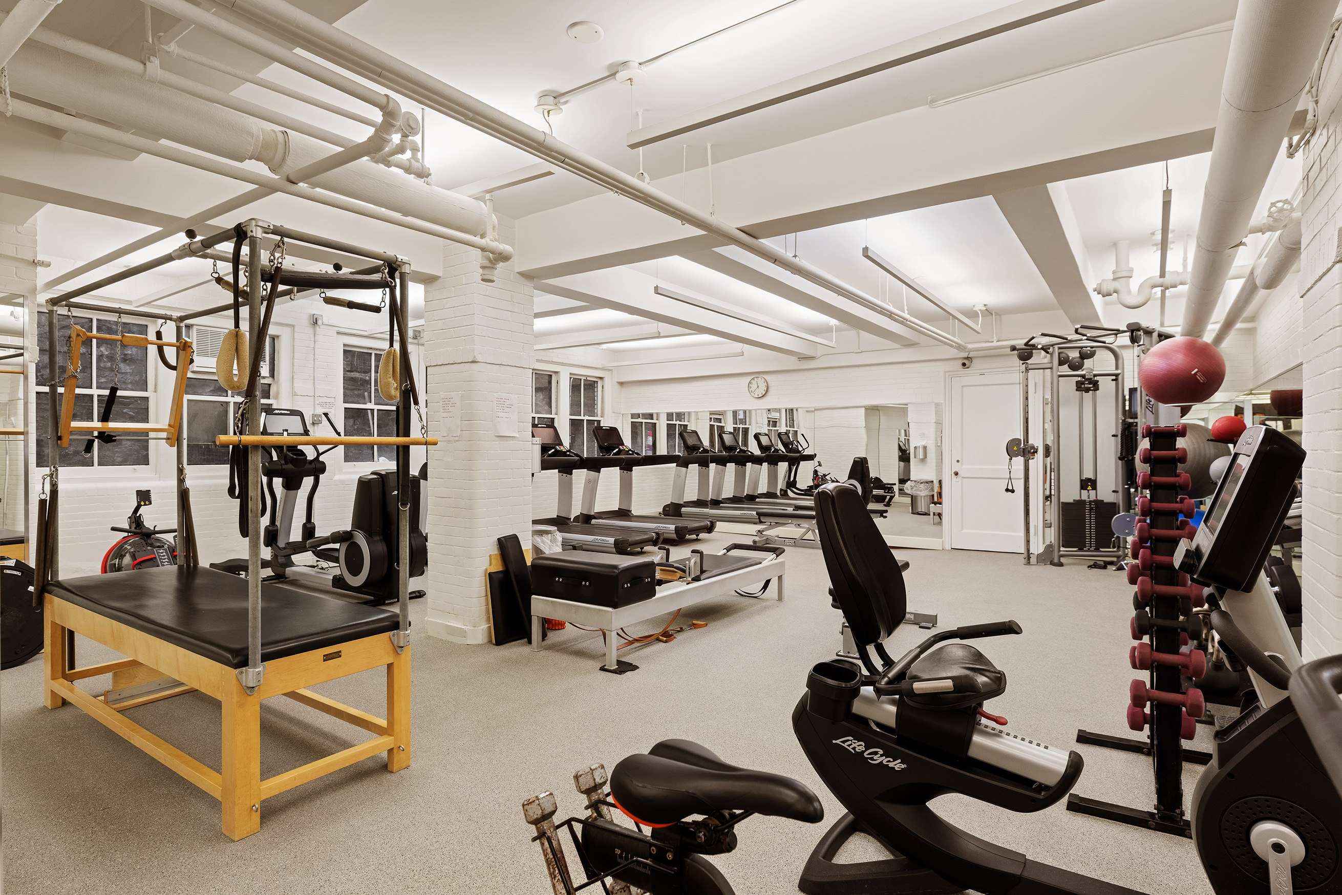 130 East 75th Street, Unit 4D Manhattan, NY 10021 - Photo 16 of 19 a view of a room with gym equipment