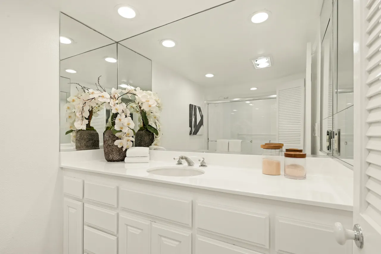 a bathroom with a sink and a mirror