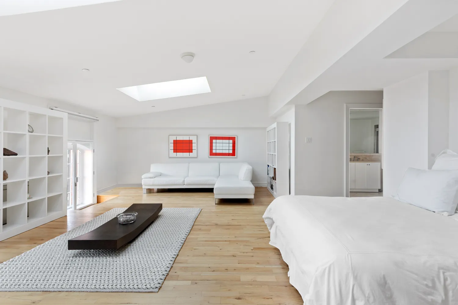 a bedroom with a bed and a couch