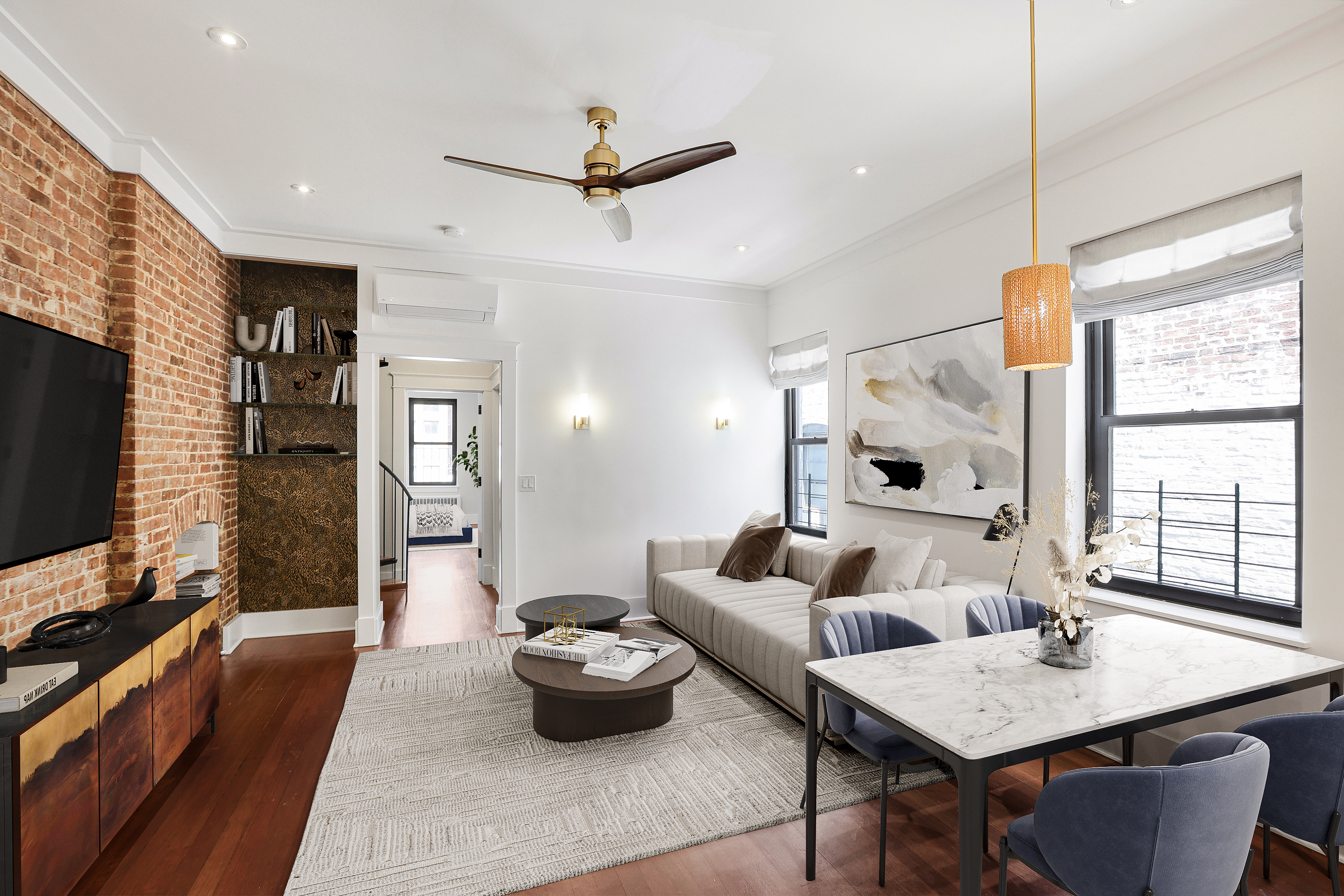 133 East 30th Street, Unit PH5B Manhattan, NY 10016 - Photo 1 of 24 a living room with furniture and a flat screen tv