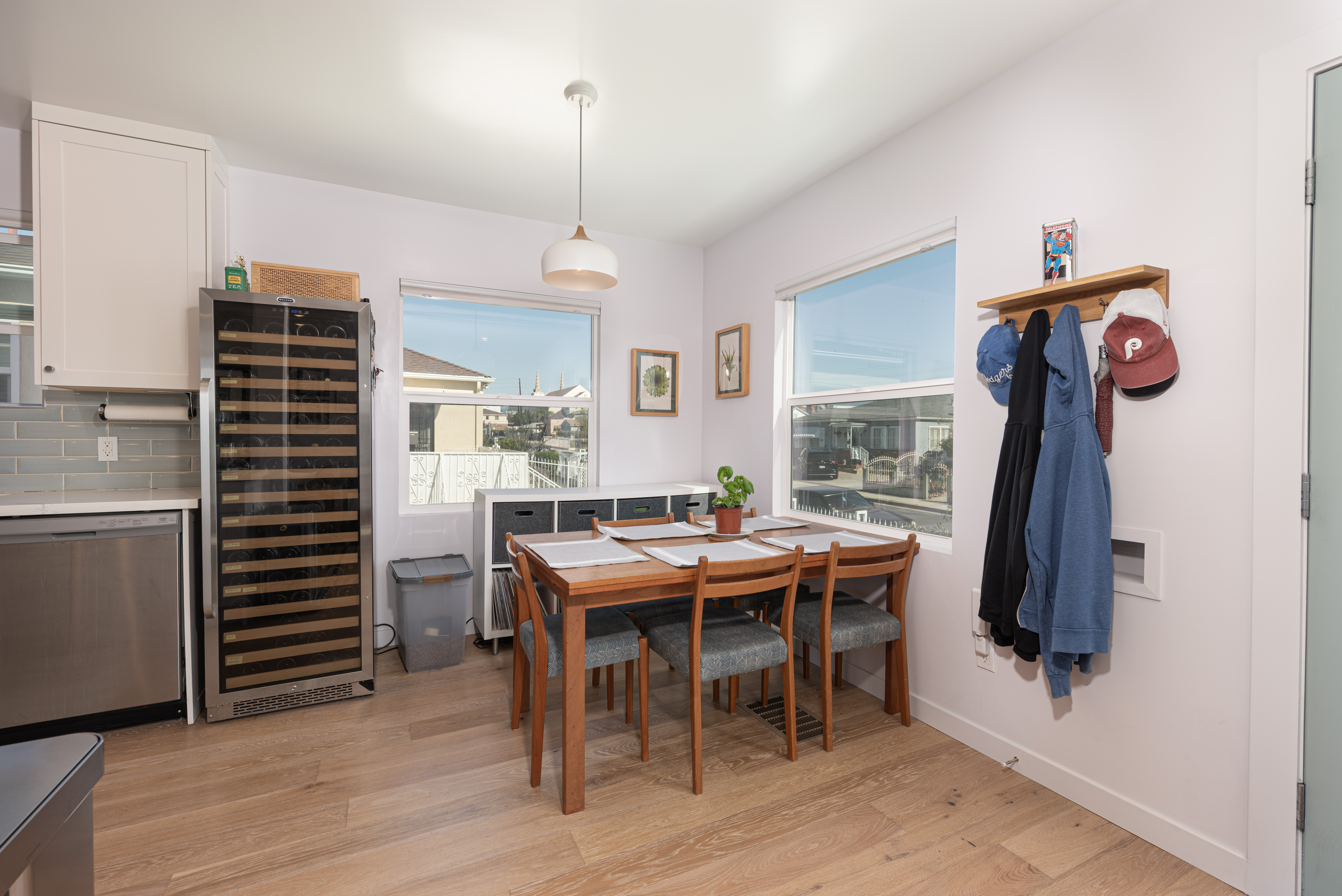 1005 Alexandria Avenue Los Angeles, CA 90029 - Photo 9 of 21 a view of a dining room and livingroom with furniture wooden floor a rug a rug a fireplace and a chandelier