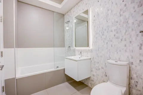 a bathroom with a toilet a sink and bathtub