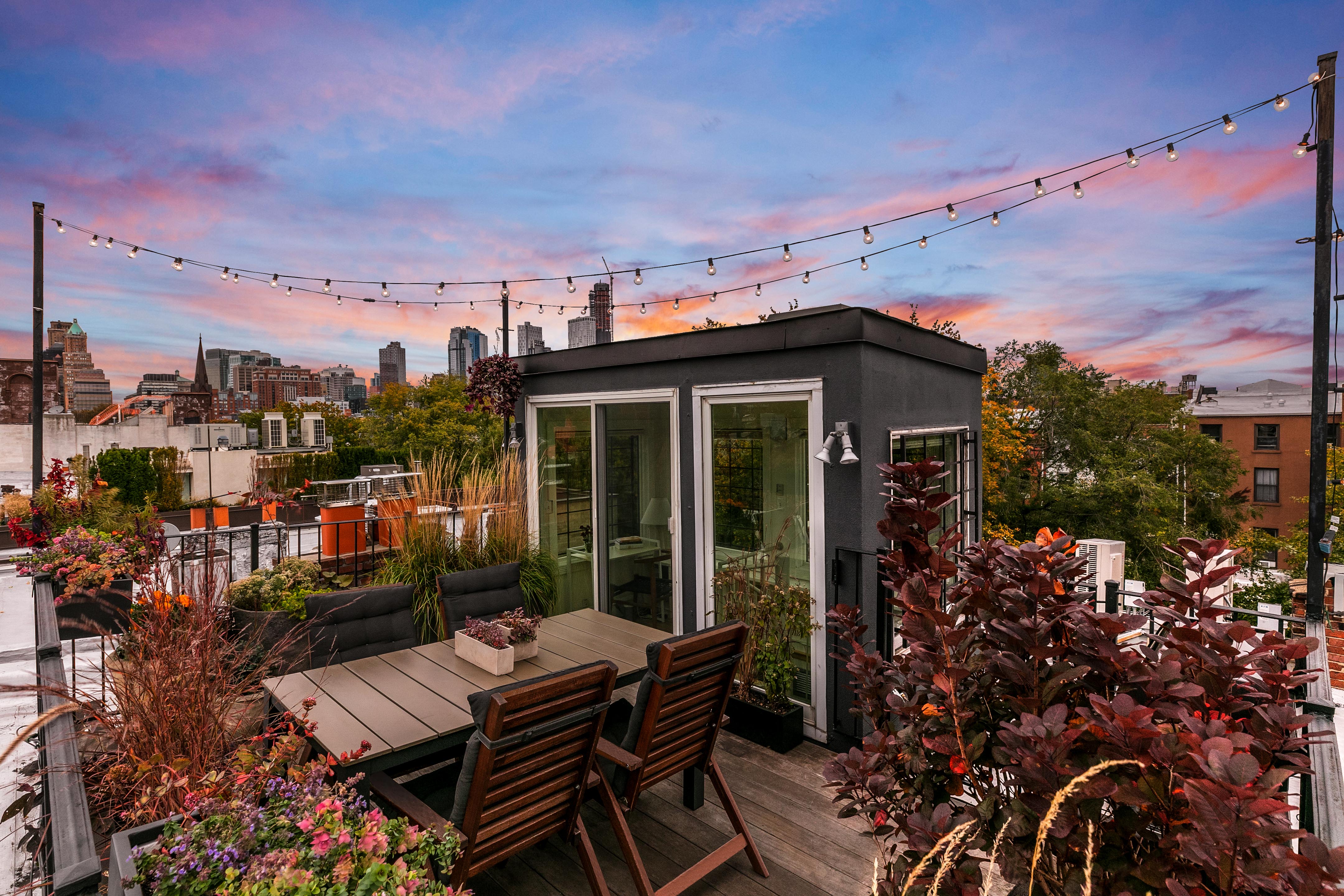 33 Tompkins Place, Unit 3 Brooklyn, NY 11231 - Photo 12 of 17 a view of a patio with table and chairs and potted plants