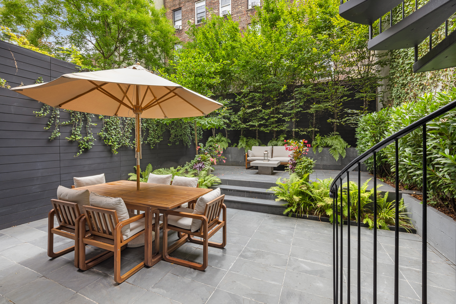 334 West 20th Street Manhattan, NY 10011 - Photo 2 of 20 a view of backyard with outdoor seating and trees