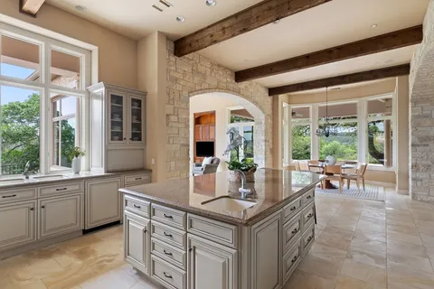 a view of living room with granite countertop furniture and fireplace