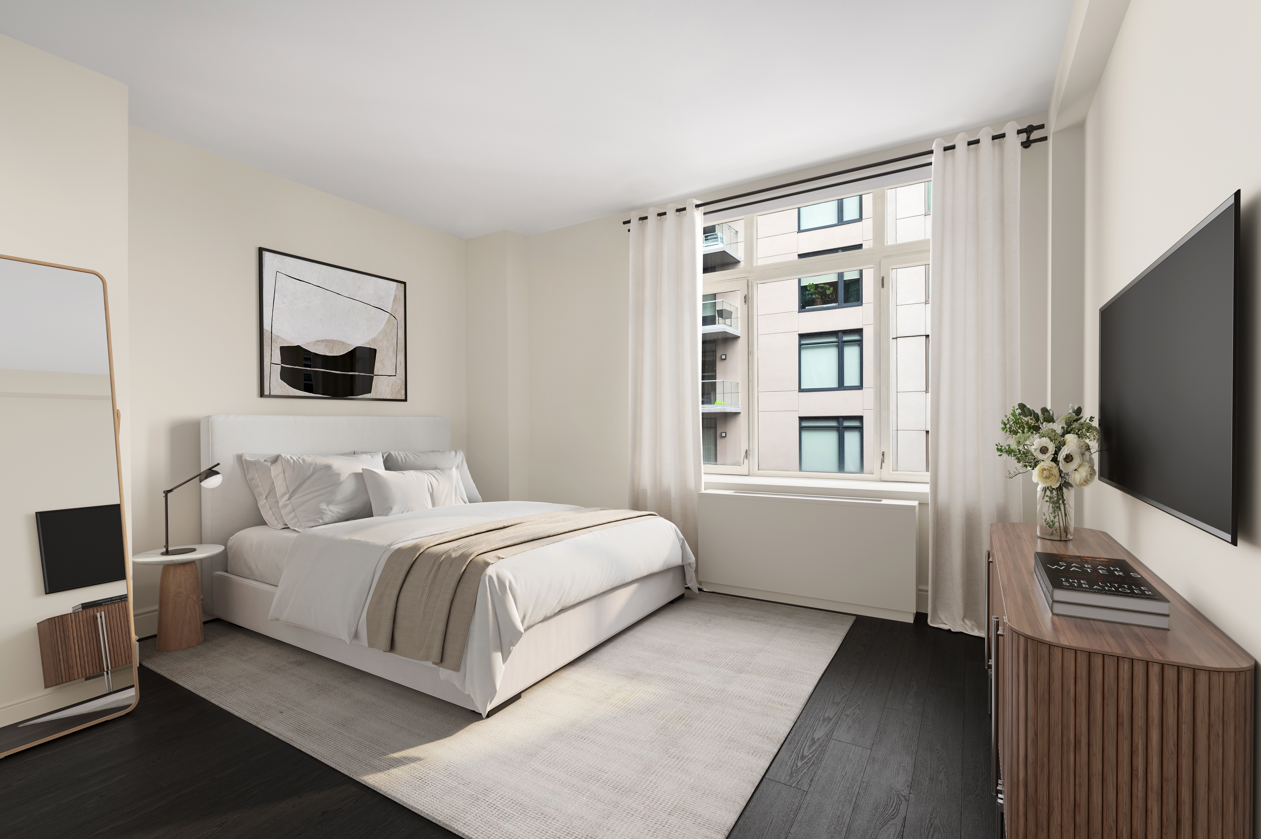 125 West 22nd Street, Unit 8B Manhattan, NY 10011 - Photo 6 of 10 a bedroom with a large bed and a flat tv screen on dresser