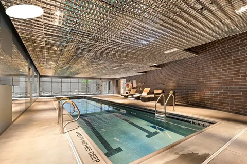 a view of a patio with swimming pool