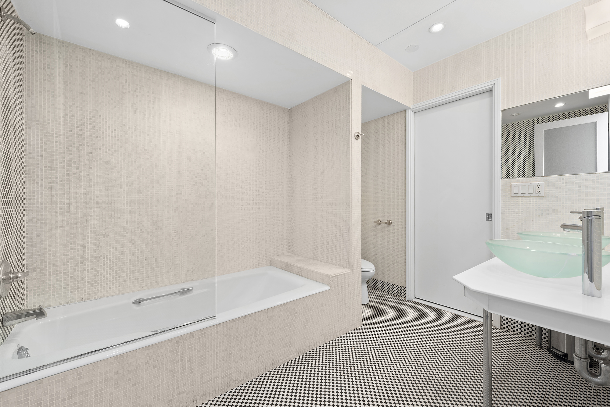 53 Murray Street, Unit 1 Manhattan, NY 10007 - Photo 11 of 12 a bathroom with a bathtub and a sink