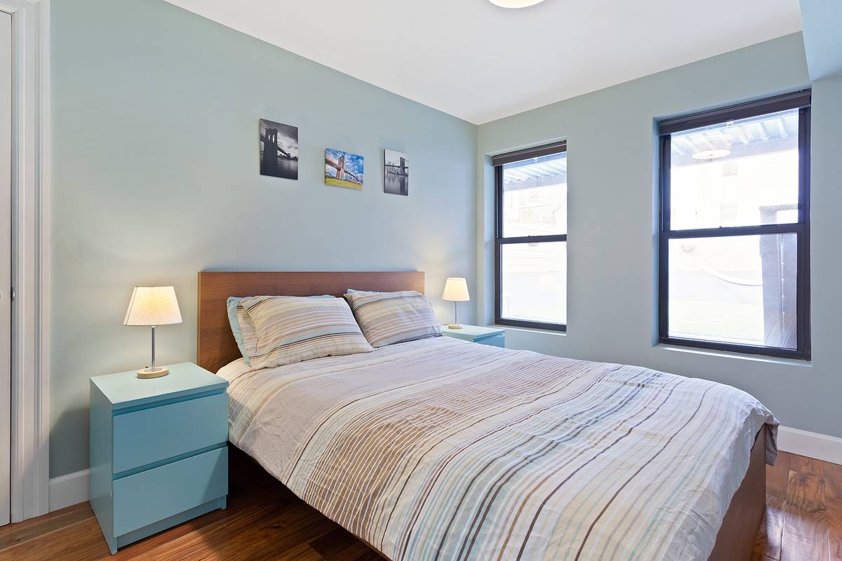 249 Halsey Street, Unit 1 Brooklyn, NY 11216 - Photo 3 of 6 a bedroom with a bed and a window