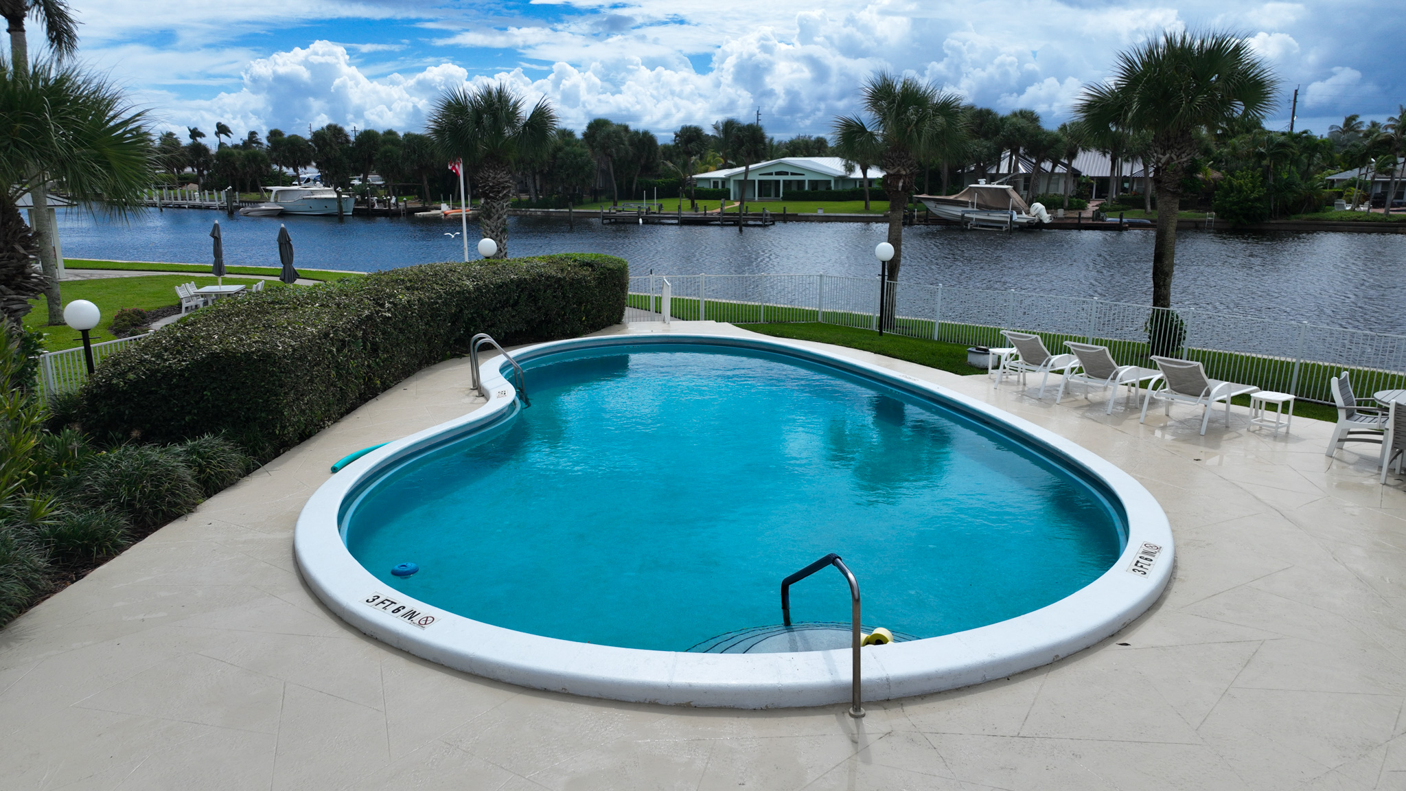 4601 Highway A1a, Unit 102 Vero Beach, FL 32963 - Photo 24 of 29 a view of a swimming pool with a lake