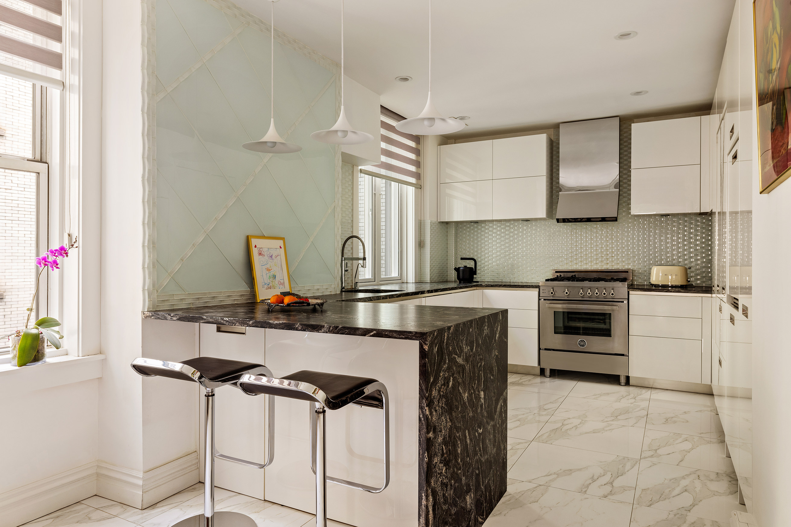 251 West 98th Street, Unit 7B Manhattan, NY 10025 - Photo 3 of 14 a kitchen with stainless steel appliances a stove a sink and a refrigerator