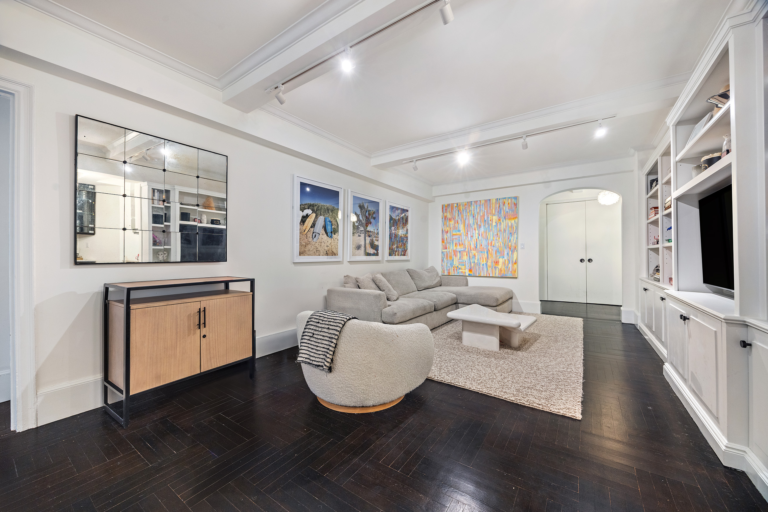 325 East 79th Street, Unit 6C Manhattan, NY 10075 - Photo 4 of 17 a living room with fireplace furniture and a flat screen tv