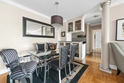 a workspace with furniture wooden floor and a rug