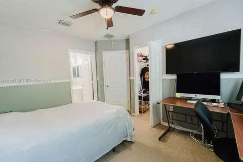 a bedroom with a workspace