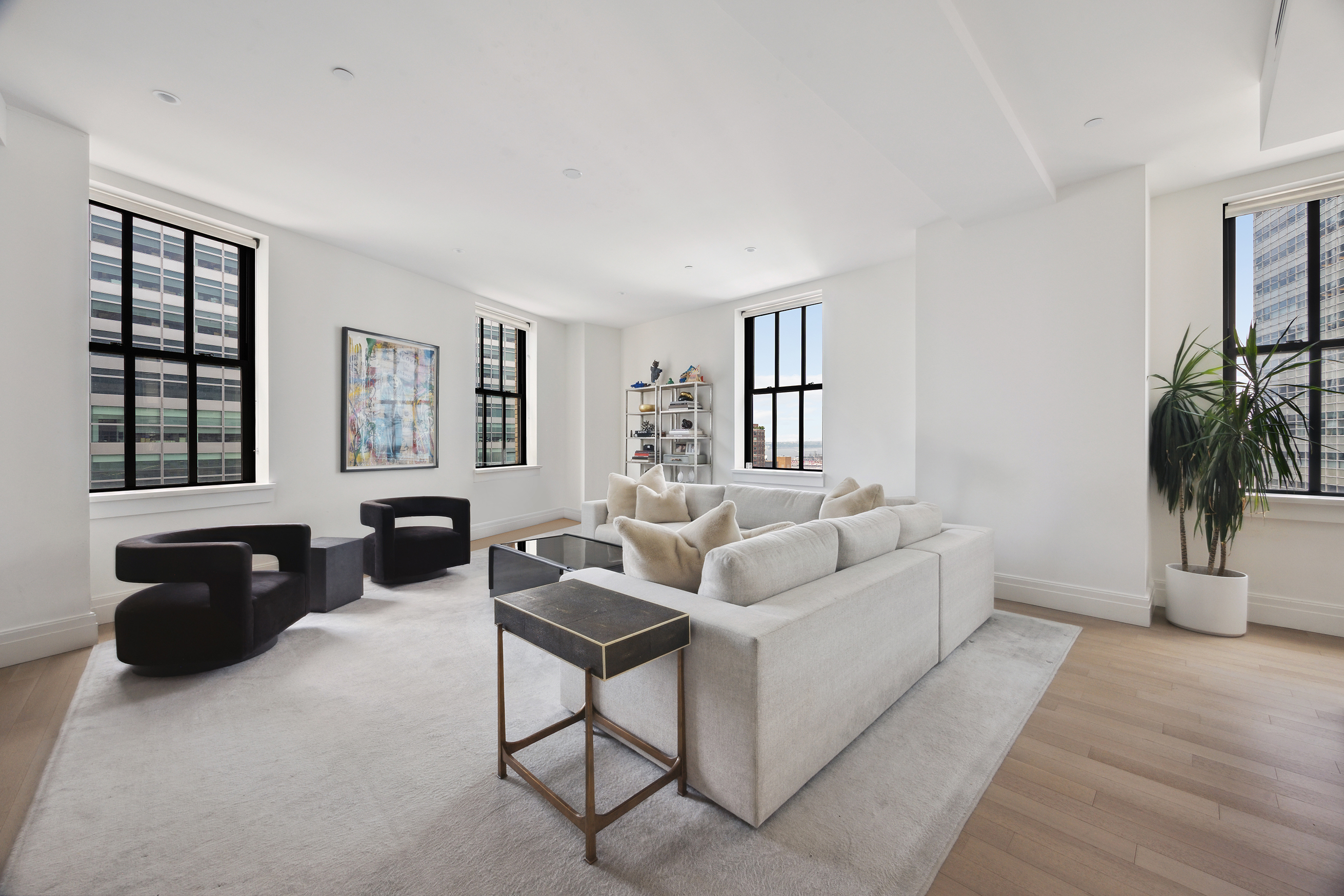 100 Barclay Street, Unit 15B Manhattan, NY 10007 - Photo 2 of 16 a living room with furniture and a large window