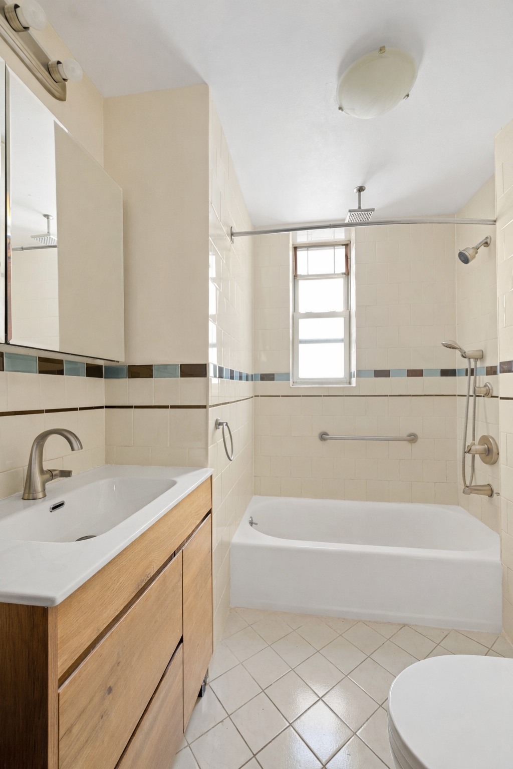 742 44th Street Brooklyn, NY 11220 - Photo 8 of 23 a bathroom with a sink and a bathtub