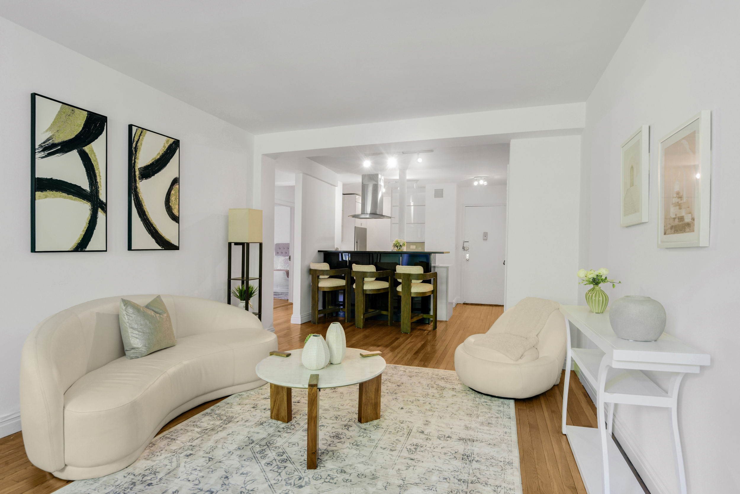 330 East 70th Street, Unit 4F Manhattan, NY 10021 - Photo 4 of 14 a living room with furniture and wooden floor