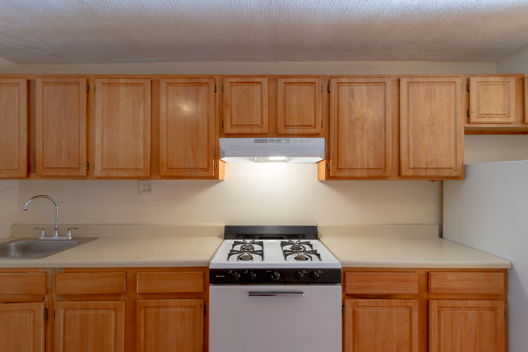 145 Atlantic Avenue, Unit 2 Brooklyn, NY 11201 - Photo 6 of 11 a kitchen with granite countertop a sink stainless steel appliances and cabinets