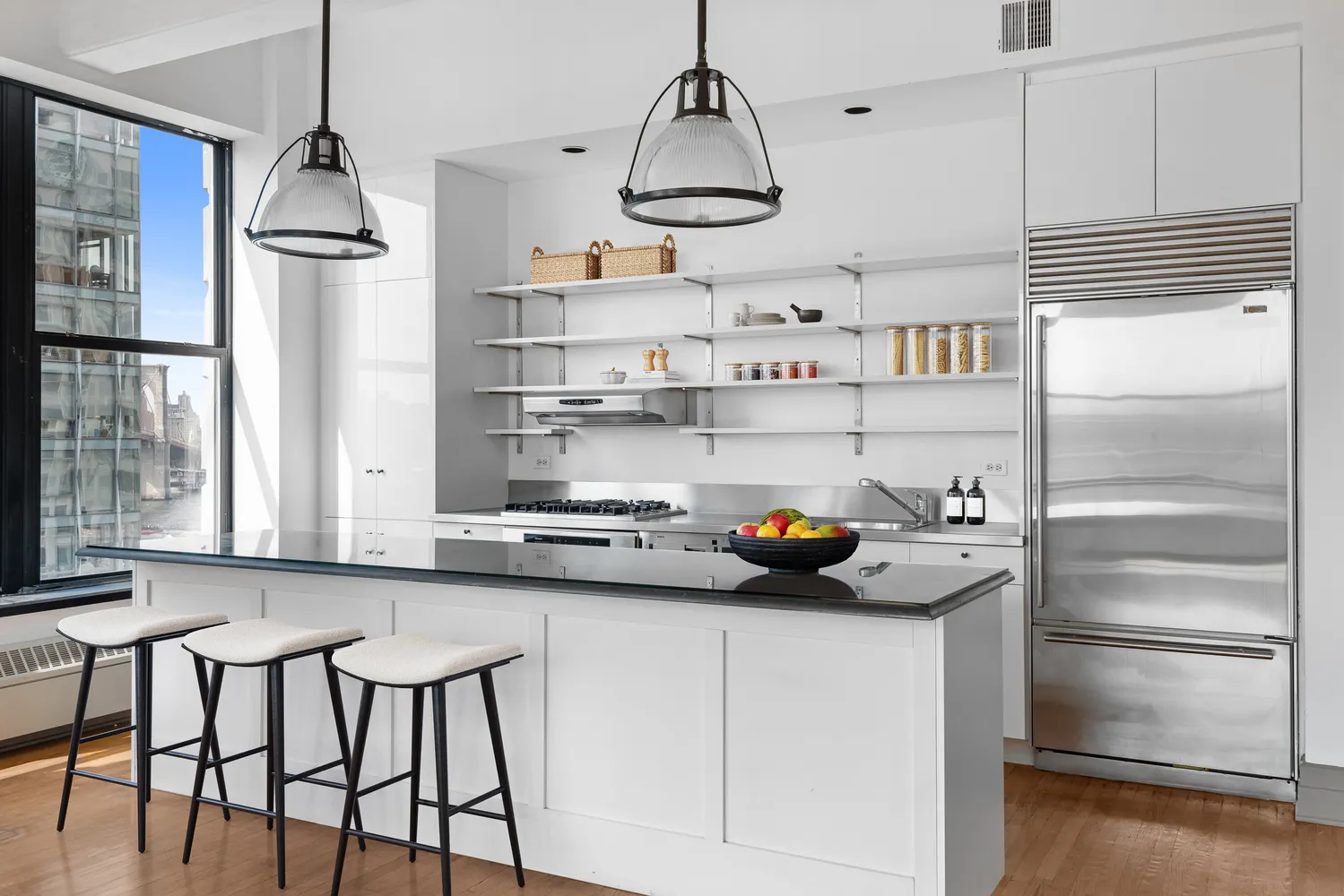 a kitchen with refrigerator and cabinets