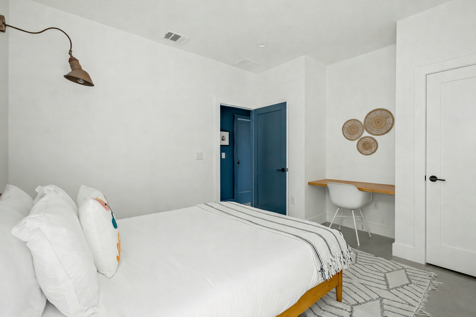 2201 Santa Rosa Street Austin, TX 78702 - Photo 13 of 47 a bedroom with a bed and lamp