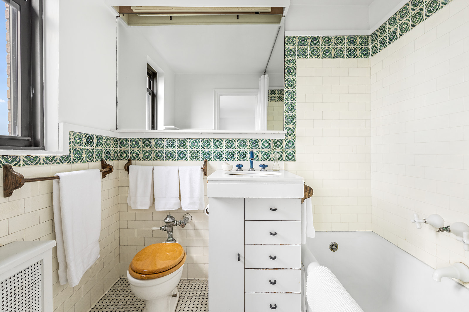 110-118 Riverside Drive, Unit 15A Manhattan, NY 10024 - Photo 14 of 17 a bathroom with a sink a toilet and shower
