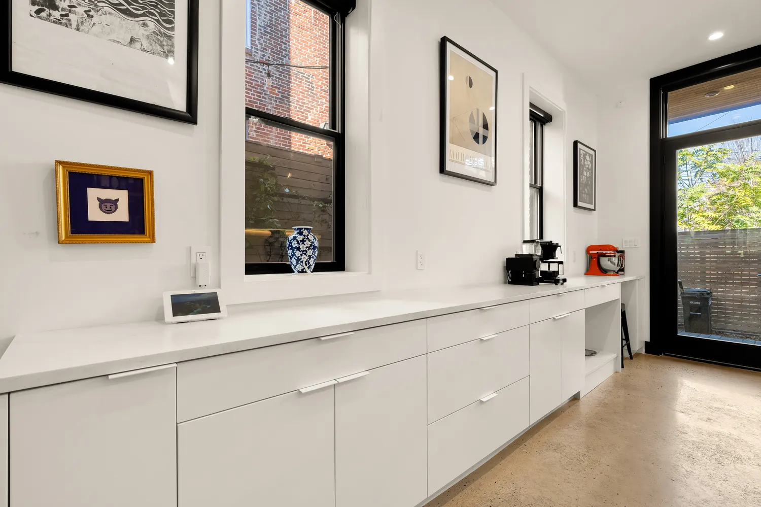 a bathroom with a double vanity sink and a window