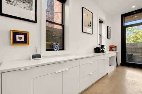 a bathroom with a double vanity sink and a window