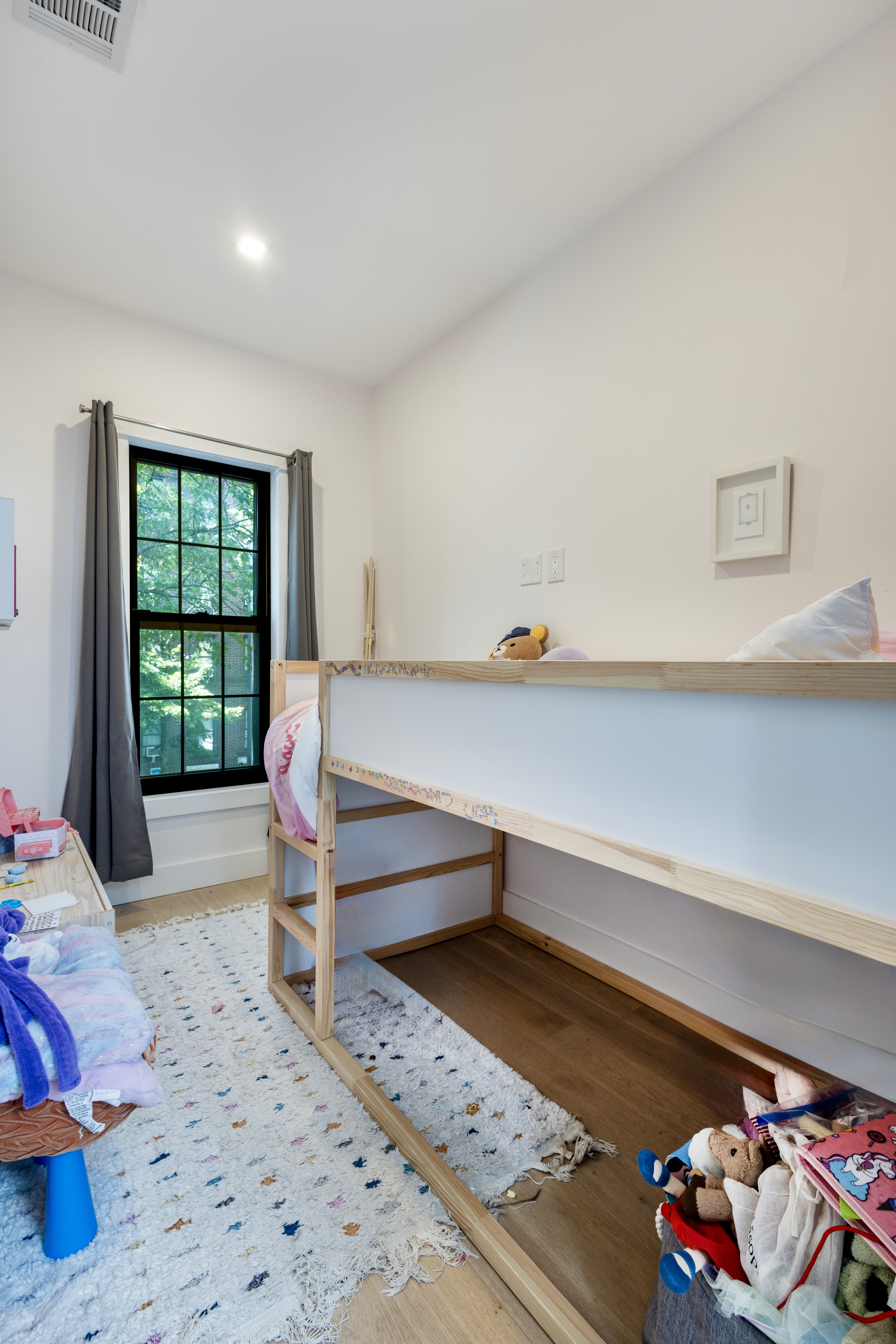 239 Winthrop Street Brooklyn, NY 11225 - Photo 18 of 20 a bedroom with furniture and a window