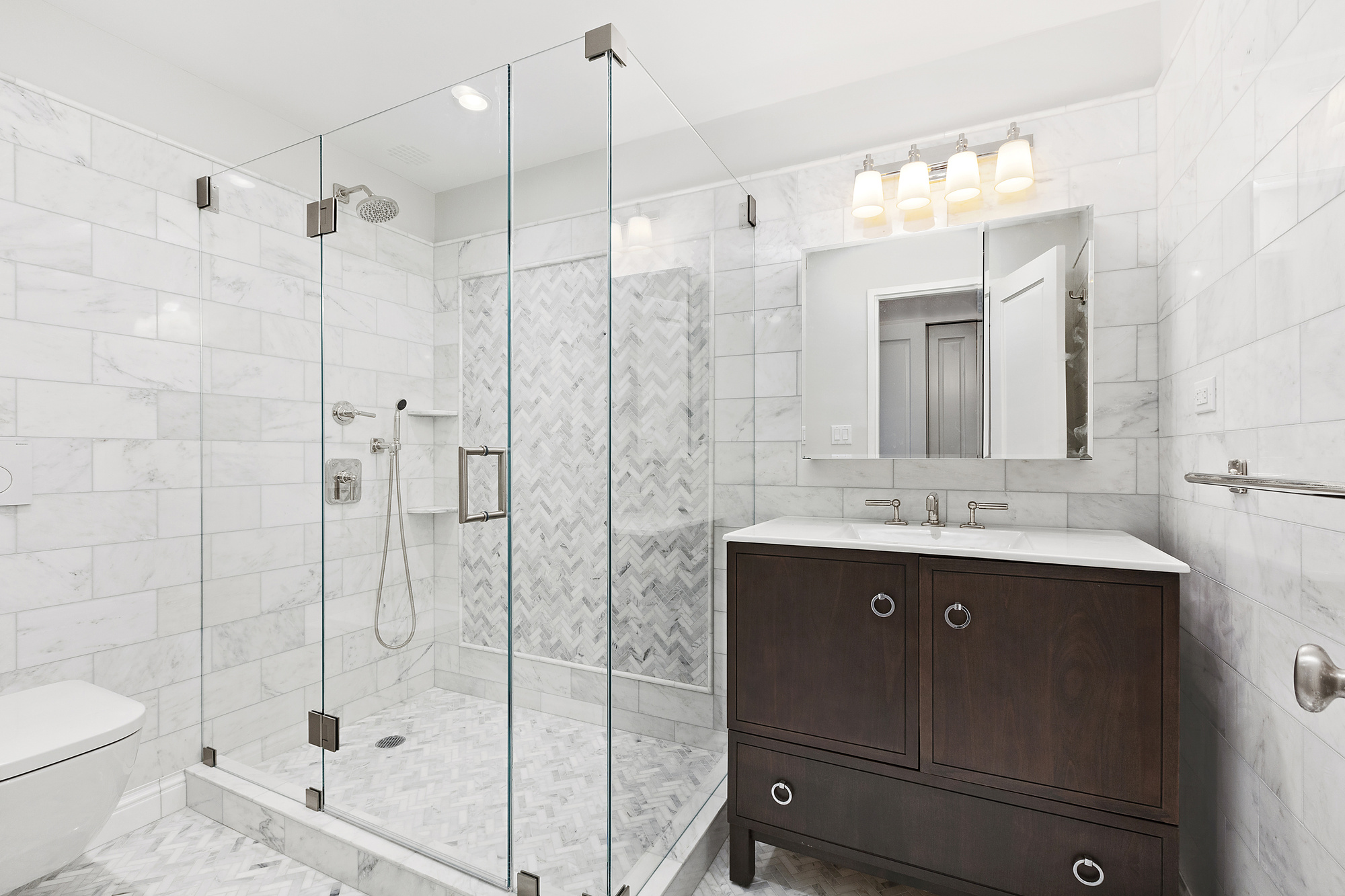522 East 82nd Street, Unit 1 Manhattan, NY 10028 - Photo 14 of 16 a bathroom with a sink a toilet and shower