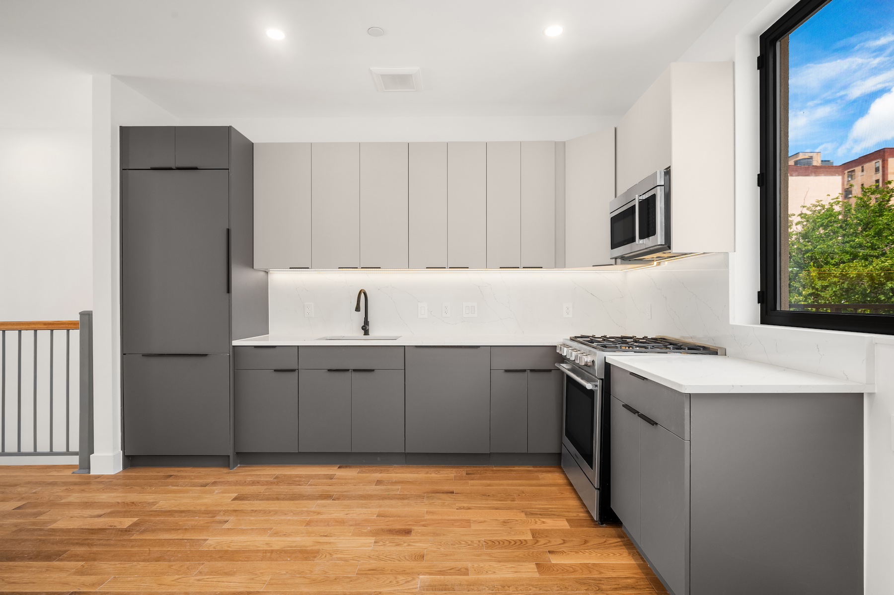 61 West 70th Street, Unit PH Manhattan, NY 10023 - Photo 5 of 18 a kitchen with granite countertop a sink and a stove top oven