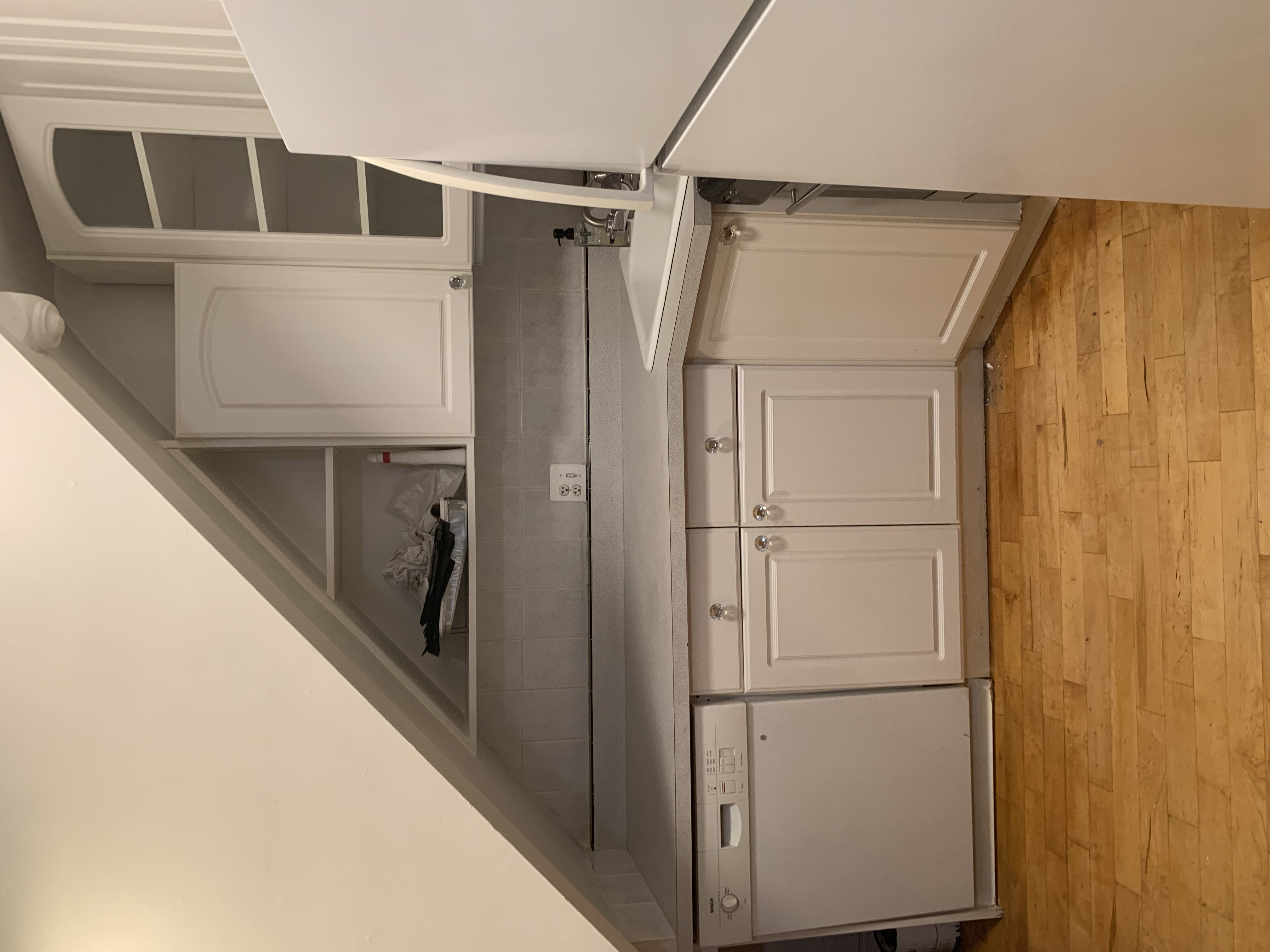 538 44th Street, Unit 2 Brooklyn, NY 11220 - Photo 4 of 6 a view of kitchen with white cabinets and a refrigerator
