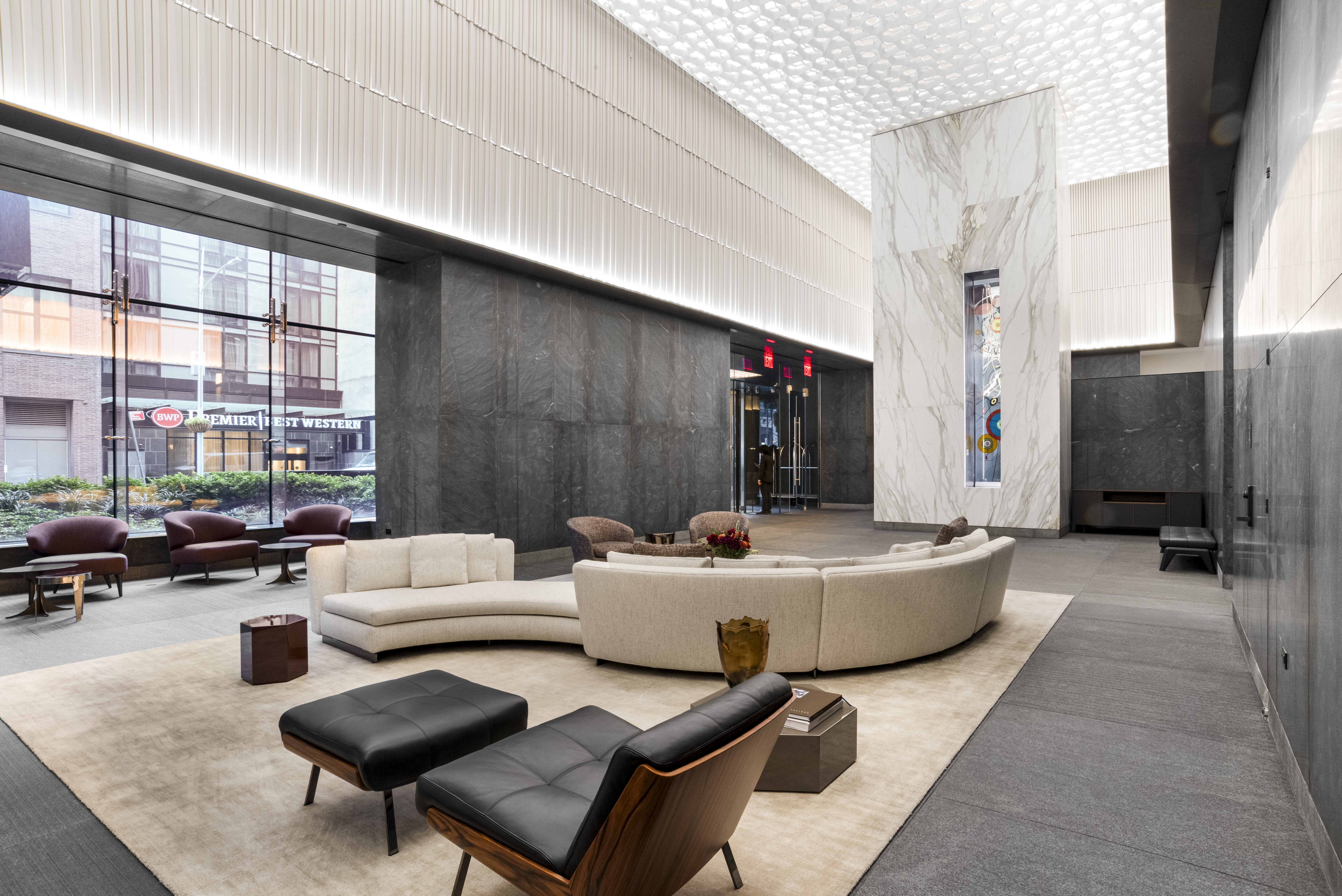 15 East 30th Street, Unit Undisclosed Manhattan, NY 10016 - Photo 12 of 23 a living room with furniture and a flat screen tv
