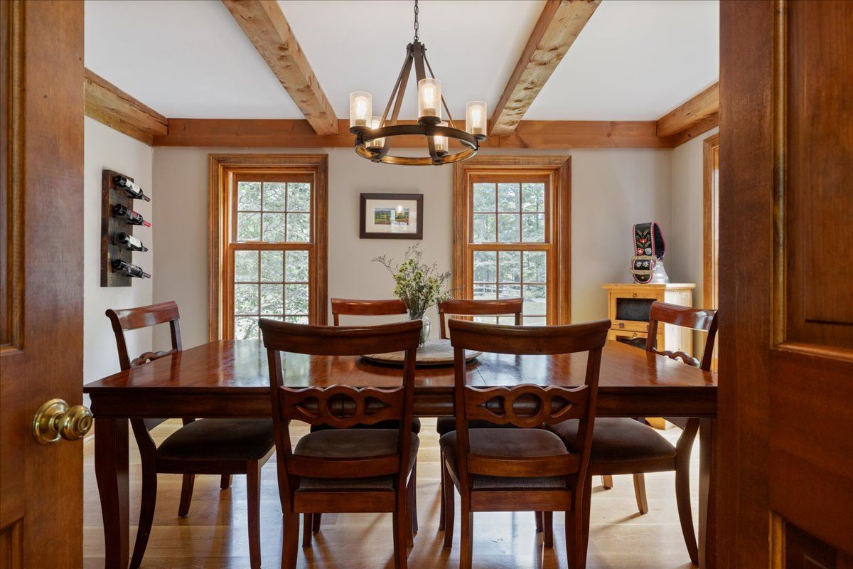 a dining room with furniture and window