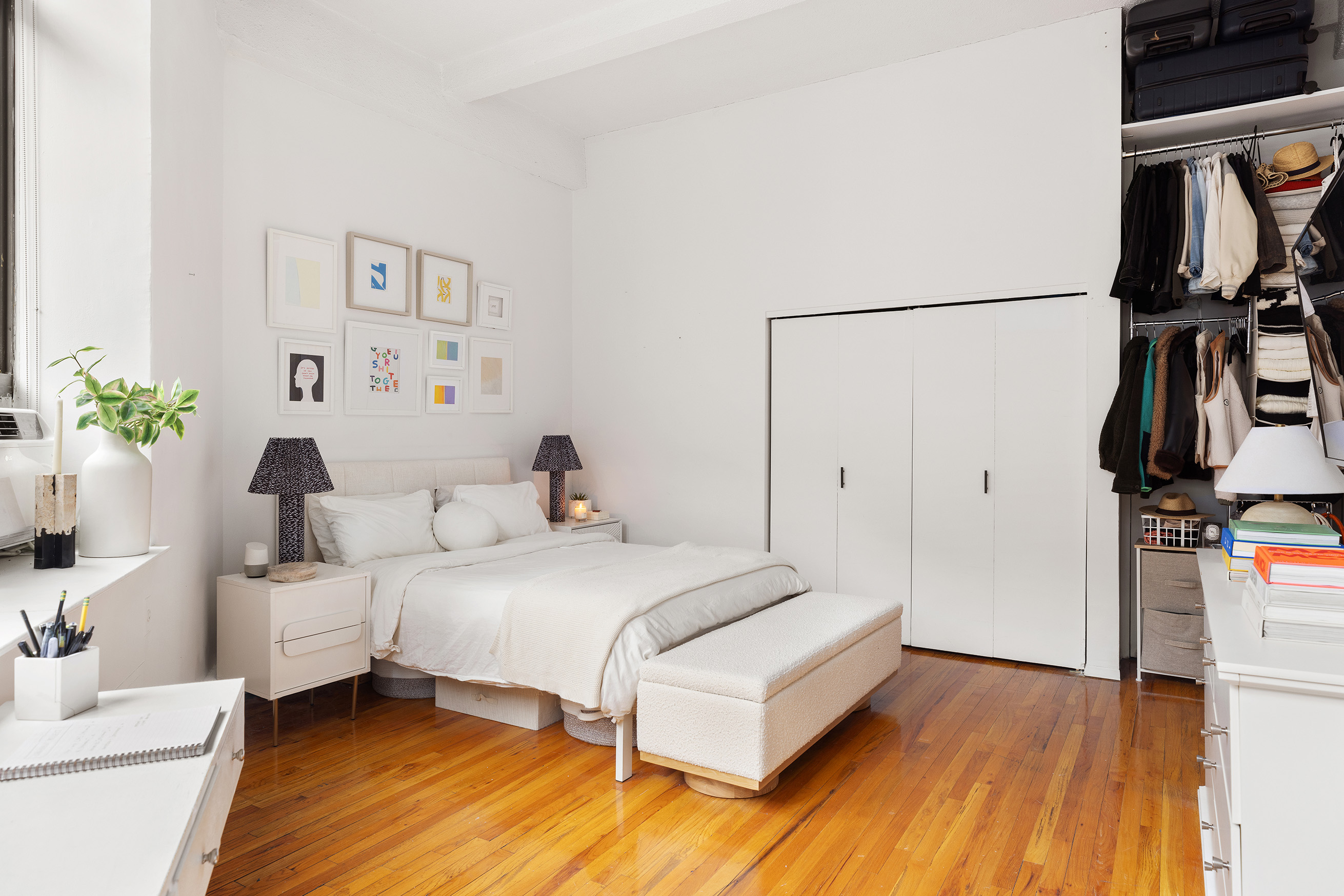 2 Cornelia Street, Unit 201 Manhattan, NY 10014 - Photo 5 of 11 a bedroom with a bed and a table