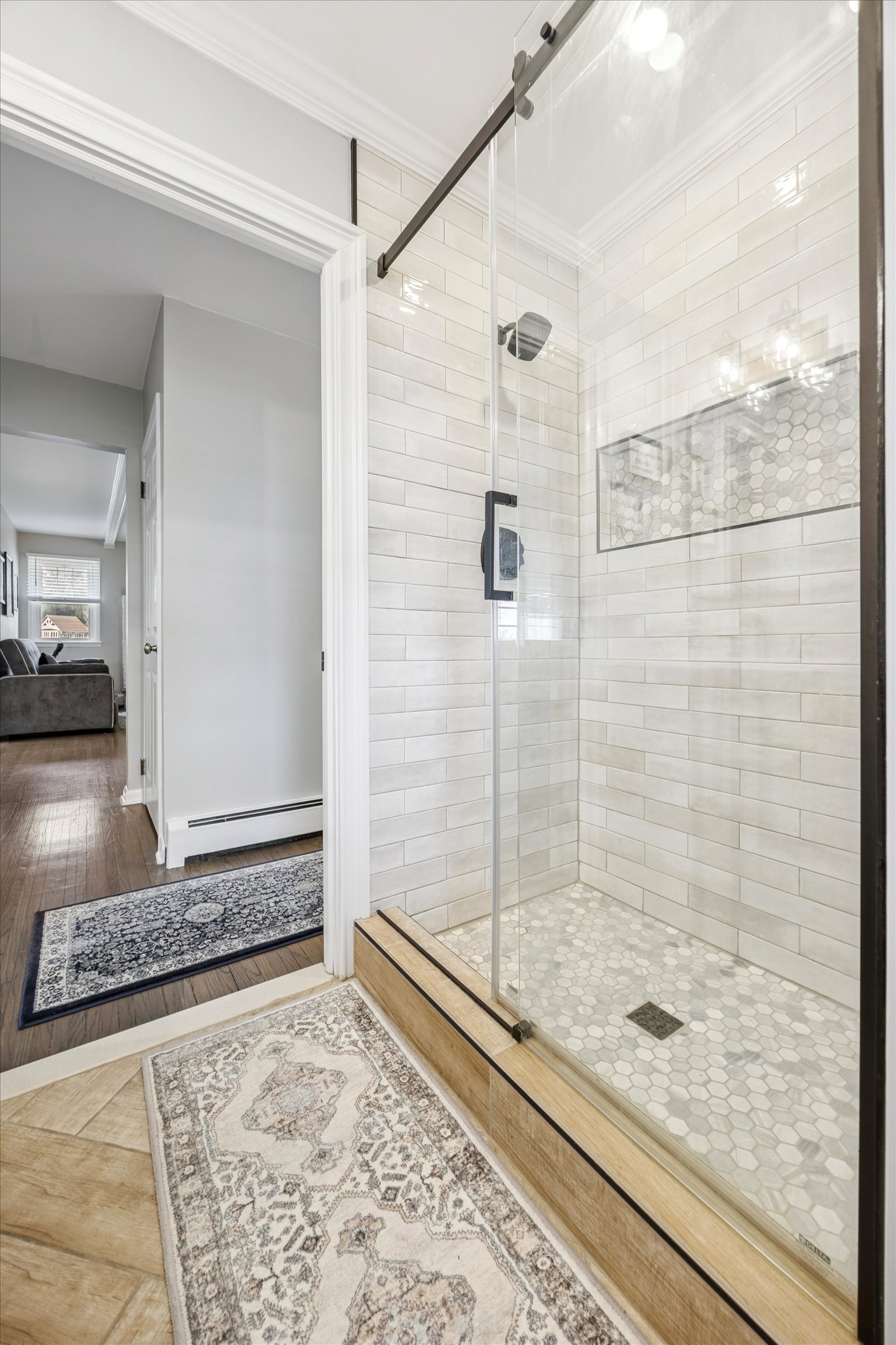 535 Bell Lane Ambler, PA 19002 - Photo 15 of 45 a bathroom with a granite countertop shower a mirror and a bathtub