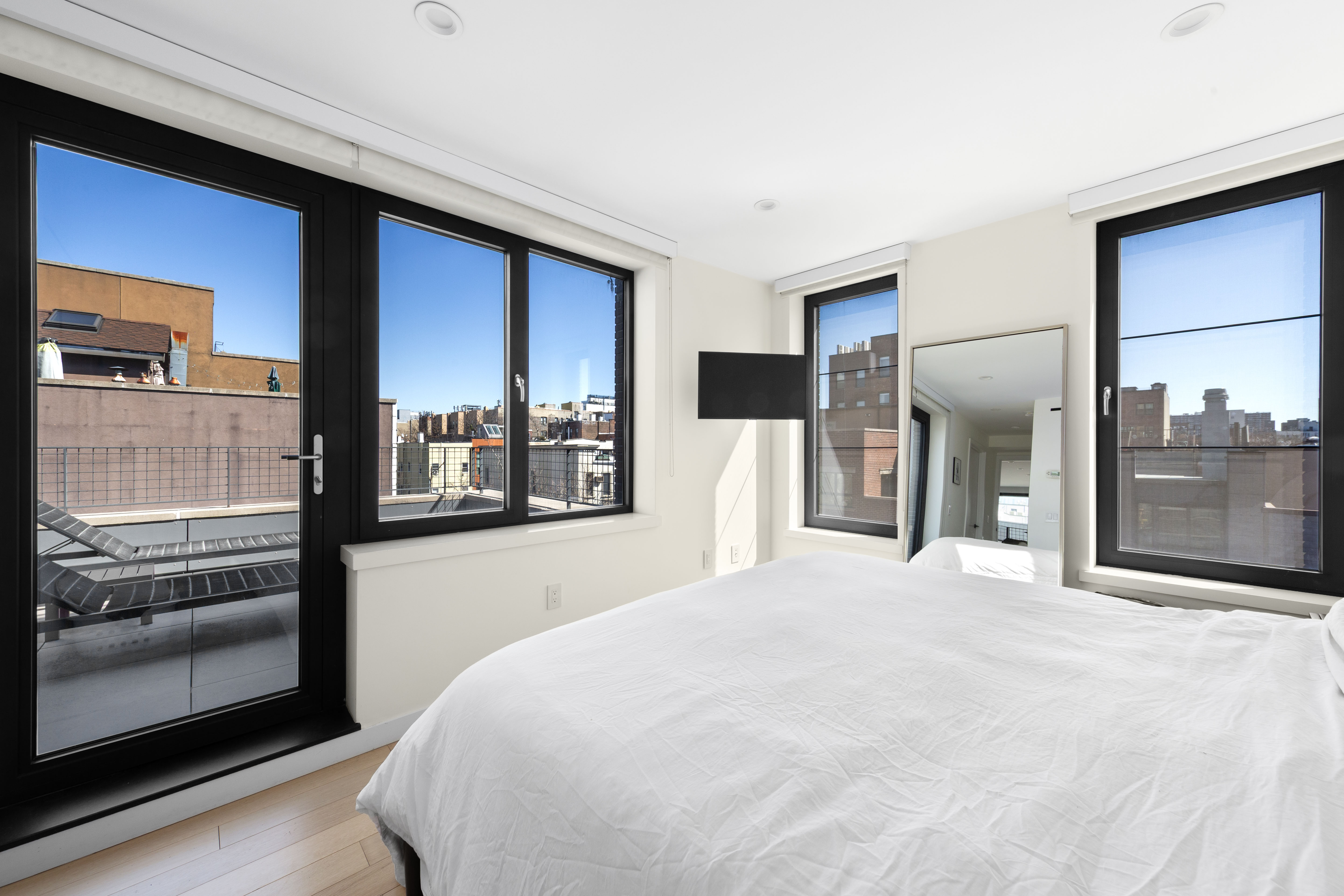 33 Conselyea Street, Unit PH Brooklyn, NY 11211 - Photo 6 of 16 a large white bed in a hotel room