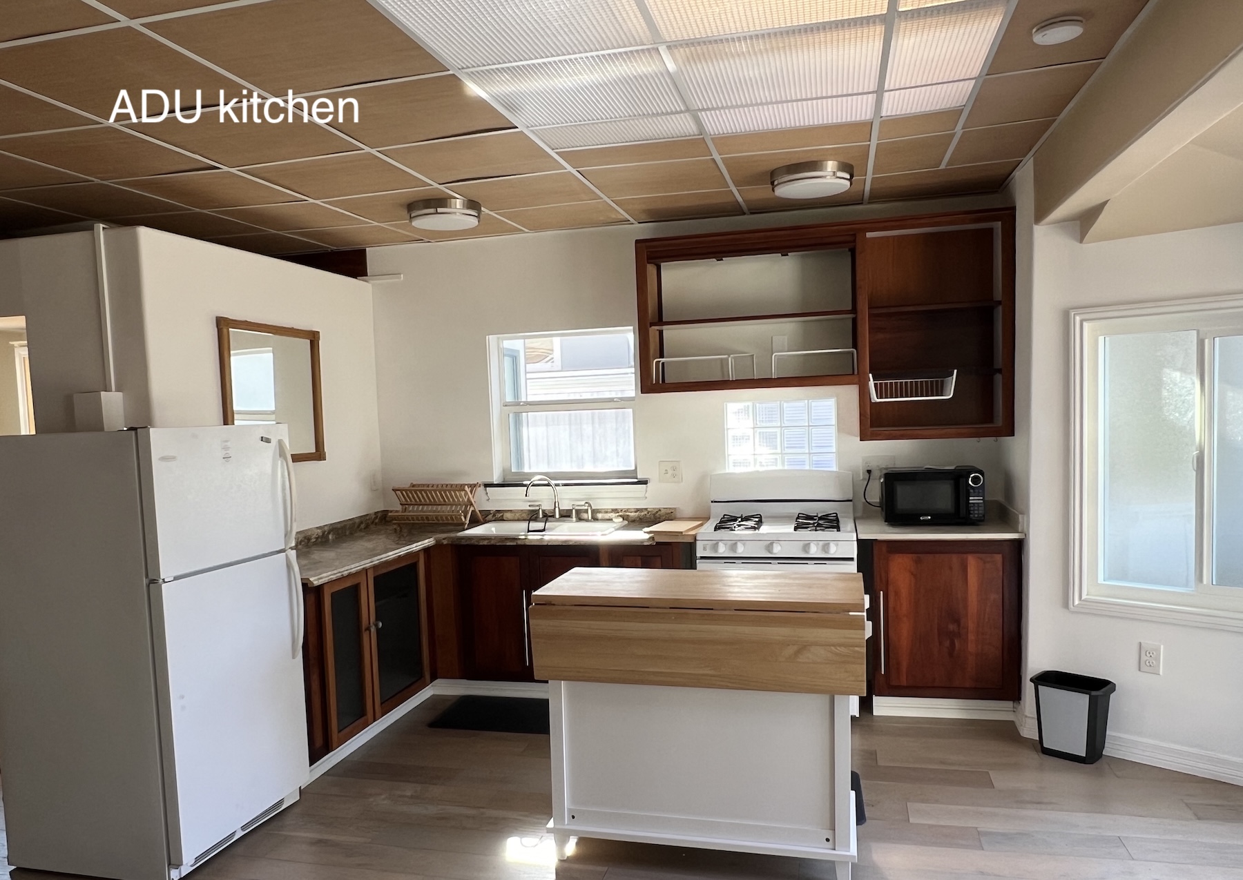 534 Hoover Street Oceanside, CA 92054 - Photo 23 of 31 a kitchen with a stove window and refrigerator