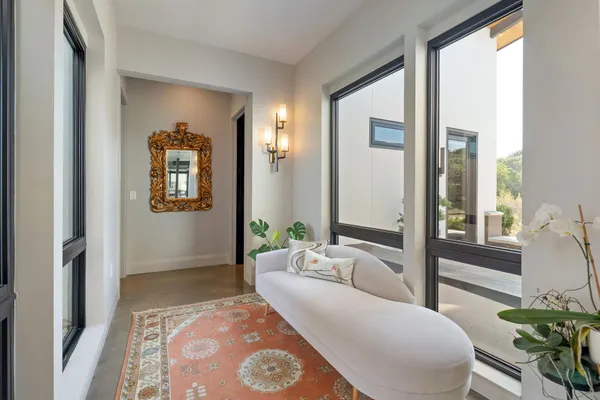 a bedroom with a bed and a painting on the wall