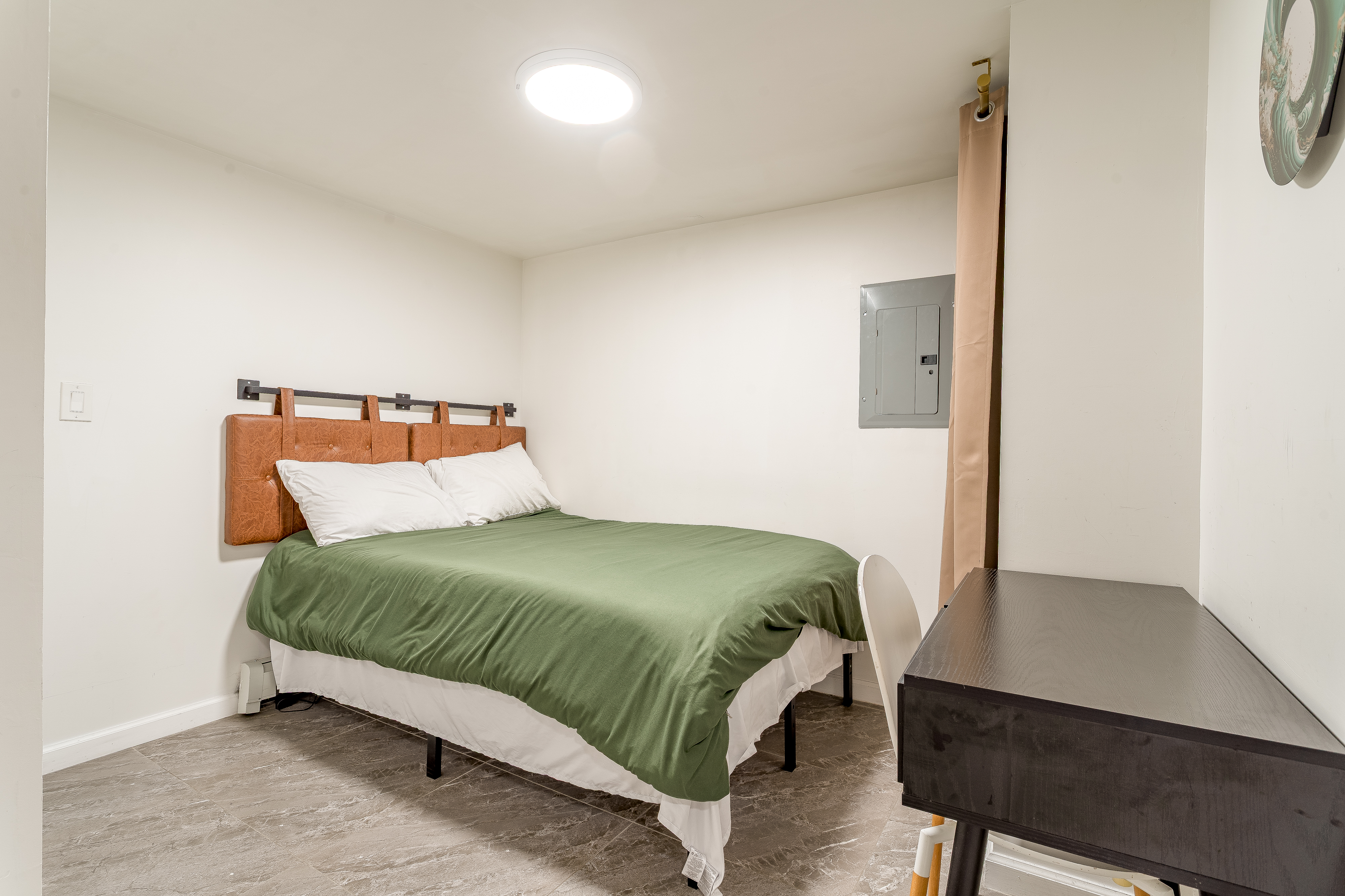 212 East 70th Street, Unit B Manhattan, NY 10021 - Photo 11 of 17 a bedroom with a bed and a desk