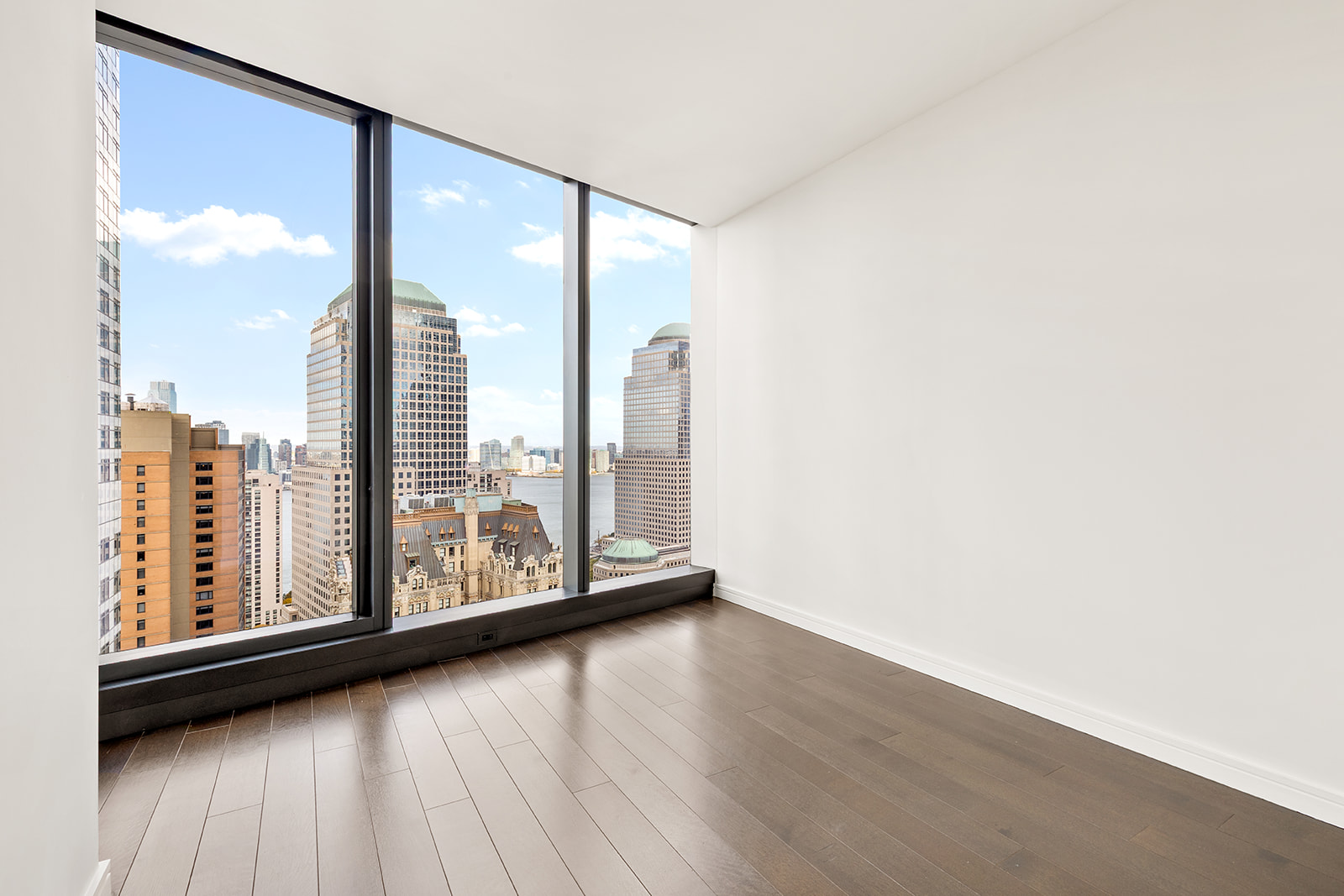 125 Greenwich Street, Unit 37C Manhattan, NY 10006 - Photo 13 of 24 a view of a large window with wooden floor