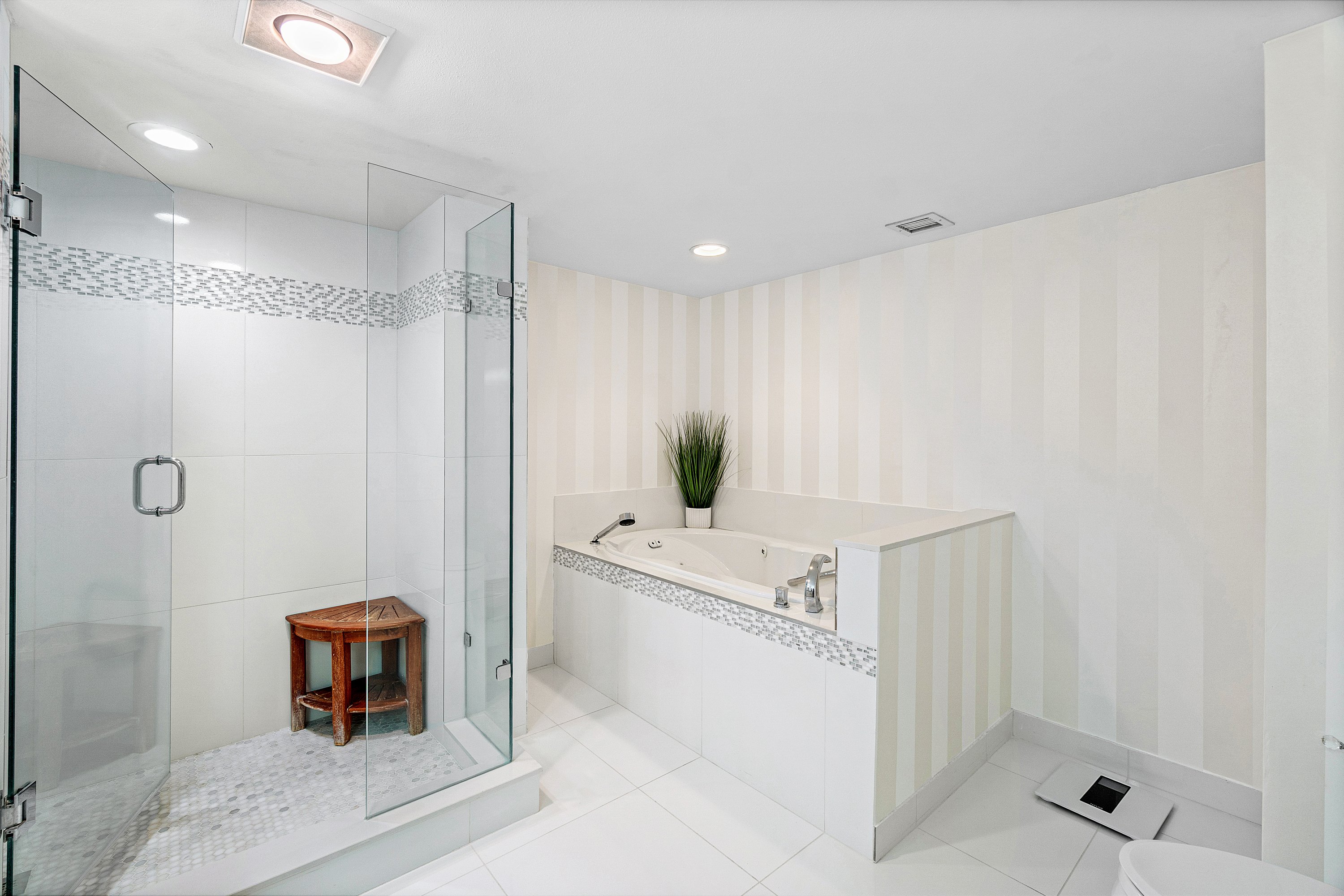 2003 North Ocean Boulevard, Unit 305 Boca Raton, FL 33431 - Photo 44 of 56 a bathroom with a tub and shower