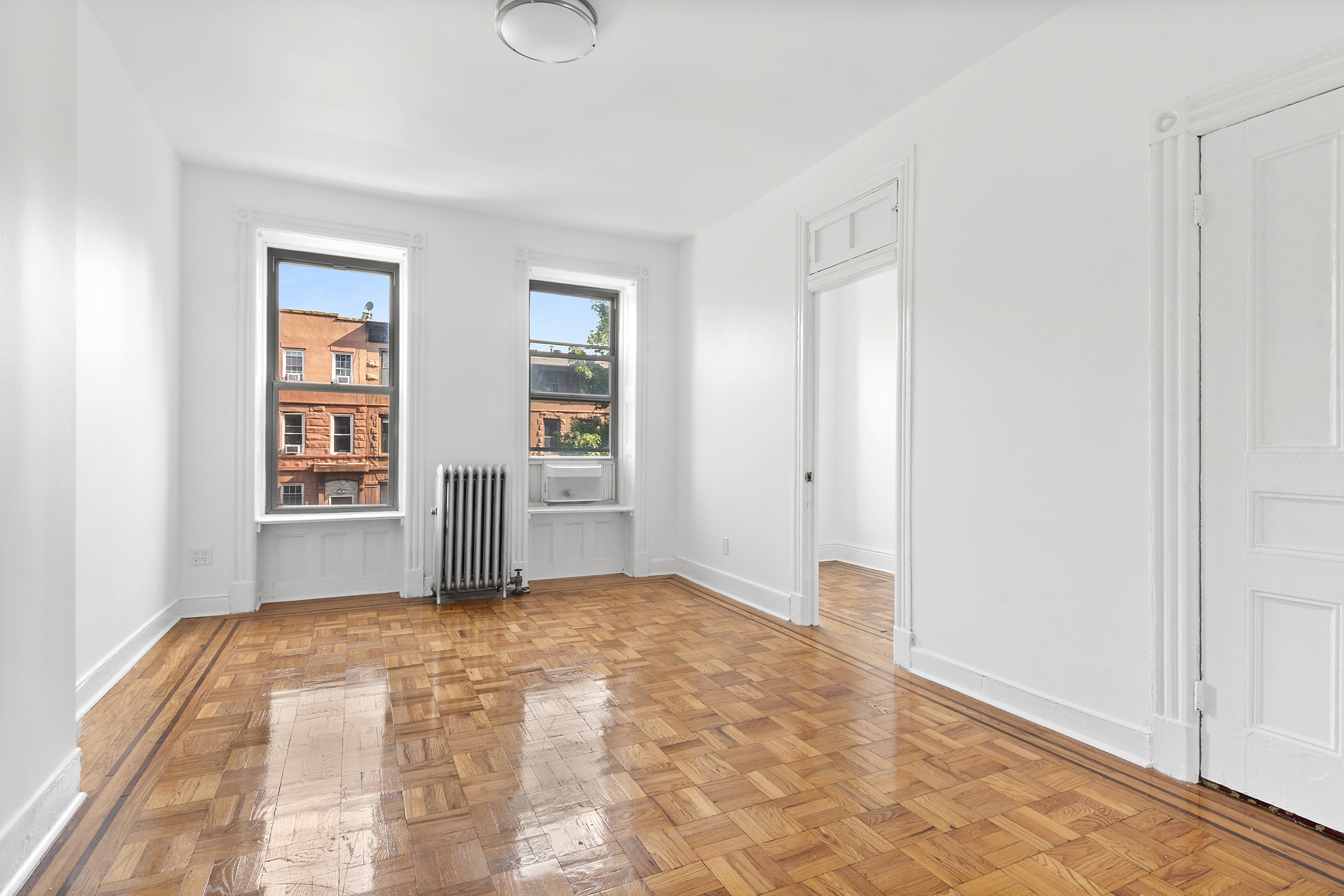 28 A Hart Street, Unit 3 Brooklyn, NY 11206 - Photo 2 of 6 a view of an empty room with a window