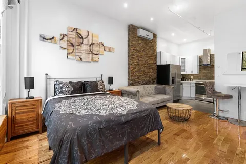 a bedroom with a bed and furniture