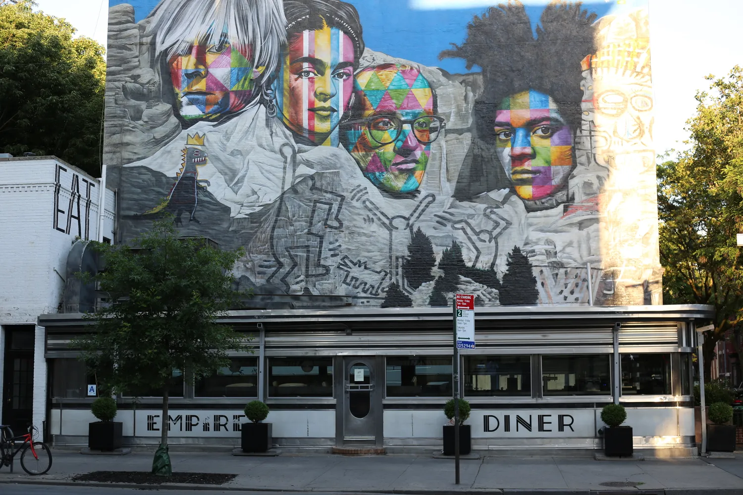 a front view of a building with glass windows and door