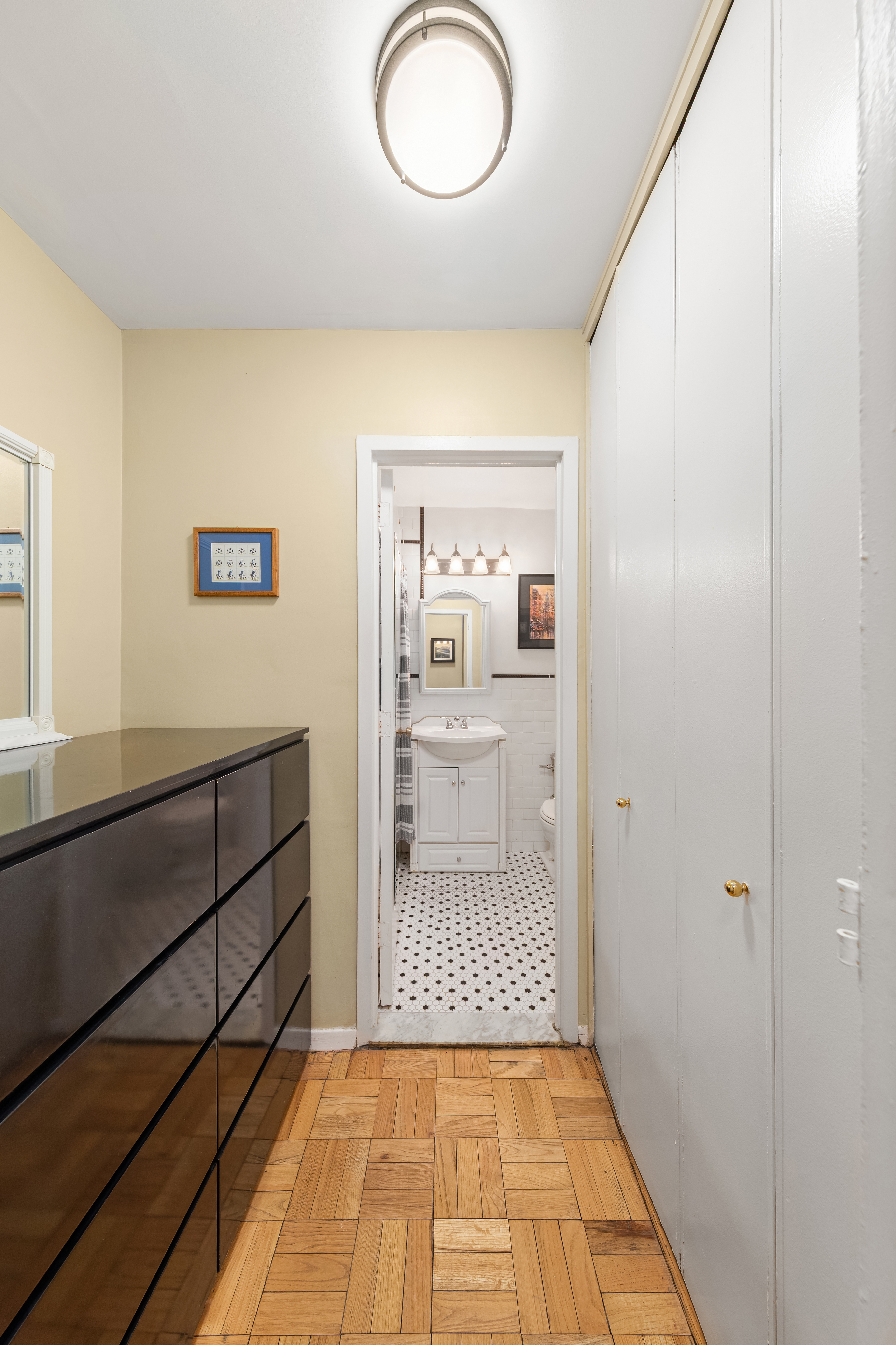 1160 3rd Avenue, Unit 3B Manhattan, NY 10065 - Photo 5 of 6 a bathroom with a sink and a mirror